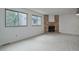 Spacious living room with fireplace and light gray flooring at 4134 S Fraser Way # E, Aurora, CO 80014