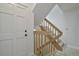 Indoor staircase with light wood railing and flooring at 4134 S Fraser Way # E, Aurora, CO 80014