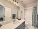 Bright bathroom featuring a tub-shower combo with modern fixtures and a granite countertop vanity at 5535 W 96Th Pl, Westminster, CO 80020