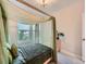 Bright bedroom featuring a canopy bed, fairy lights, natural light and modern decor at 5535 W 96Th Pl, Westminster, CO 80020