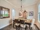 Well-lit dining room with stylish decor, hardwood floors, and neutral wall colors creating an inviting atmosphere at 5535 W 96Th Pl, Westminster, CO 80020