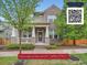 Charming two-story brick home with a covered front porch, well-maintained landscaping, and mature trees in a suburban neighborhood at 5535 W 96Th Pl, Westminster, CO 80020
