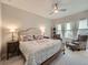 Relaxing main bedroom with a ceiling fan, comfortable bed, and bright natural light at 5535 W 96Th Pl, Westminster, CO 80020