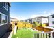 Spacious backyard featuring artificial grass, wooden privacy fence, and a play set for outdoor fun at 3722 Sandy Vista Trl, Castle Rock, CO 80104