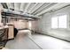 Bright unfinished basement with covered walls and smooth concrete flooring at 3722 Sandy Vista Trl, Castle Rock, CO 80104
