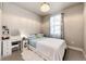 Cozy bedroom featuring a decorative light fixture, plush rug, and a vanity at 3722 Sandy Vista Trl, Castle Rock, CO 80104