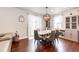 Dining area featuring a marble table, decorative chandelier, and sheer curtains for lots of light at 3722 Sandy Vista Trl, Castle Rock, CO 80104