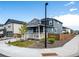 Two-story home featuring a covered porch, well-kept landscaping, and a charming, fenced yard at 3722 Sandy Vista Trl, Castle Rock, CO 80104