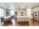 Spacious kitchen with quartz countertops, stainless steel appliances, and a breakfast bar at 3722 Sandy Vista Trl, Castle Rock, CO 80104