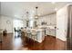 Open-concept kitchen featuring modern cabinets, stainless steel appliances, and an island with seating at 3722 Sandy Vista Trl, Castle Rock, CO 80104