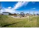 Community playground with modern play structures, green space, and seating area for residents to enjoy at 3722 Sandy Vista Trl, Castle Rock, CO 80104