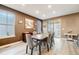 Dining room with modern table, chairs, contemporary paint, and natural light from windows at 9742 Taylor River Cir, Littleton, CO 80125