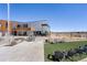 Modern building exterior with outdoor seating area and beautiful landscaping at 9742 Taylor River Cir, Littleton, CO 80125