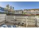 Cozy patio with white picket fence offering serene outdoor living with a view at 8199 Welby Rd # 3102, Denver, CO 80229