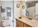 Cozy bathroom with a classic vanity, neutral countertop, framed wall decor, and ample space at 8199 Welby Rd # 3102, Denver, CO 80229
