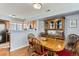 Charming dining area featuring an antique hutch and eat in kitchen at 8199 Welby Rd # 3102, Denver, CO 80229