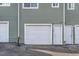 Exterior of a townhouse featuring a garage and separate entrances at 8199 Welby Rd # 3102, Denver, CO 80229