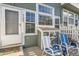 Charming front porch area with seating and lovely natural light at 8199 Welby Rd # 3102, Denver, CO 80229