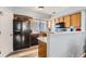 Well-lit kitchen featuring a black refrigerator and modern appliances at 8199 Welby Rd # 3102, Denver, CO 80229