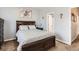 Cozy main bedroom features a king bed and a view of the attached bathroom at 8199 Welby Rd # 3102, Denver, CO 80229