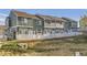 Row of townhomes with fenced yards and pleasant landscaping at 8199 Welby Rd # 3102, Denver, CO 80229