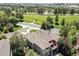 An aerial shot of a home with a well-maintained backyard and patio in a lush green neighborhood at 24733 E Park Crescent Dr, Aurora, CO 80016
