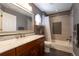 Updated bathroom boasts a modern vanity and tiled shower-tub combination at 24733 E Park Crescent Dr, Aurora, CO 80016