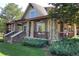 Charming community building with stone accents, inviting porch, and professionally landscaped surroundings at 24733 E Park Crescent Dr, Aurora, CO 80016