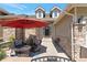 Inviting front patio with stone accents, comfortable seating, and a 'No Soliciting' sign at 24733 E Park Crescent Dr, Aurora, CO 80016
