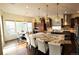 Spacious kitchen featuring a large island with granite counters, stainless steel appliances, and pendant lighting at 24733 E Park Crescent Dr, Aurora, CO 80016
