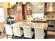 Lovely kitchen offering an island with bar seating, a wine cooler, and modern appliances at 24733 E Park Crescent Dr, Aurora, CO 80016