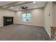 Comfortable living room with a modern fireplace and neutral carpeting at 24733 E Park Crescent Dr, Aurora, CO 80016
