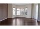 Bright room featuring hardwood floors, a bay window, neutral walls, and lots of natural light at 24733 E Park Crescent Dr, Aurora, CO 80016
