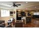 Open-concept living area features a wet bar and comfortable seating arrangement at 24733 E Park Crescent Dr, Aurora, CO 80016