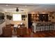Inviting living space with a wet bar and lounge area for entertaining guests at 24733 E Park Crescent Dr, Aurora, CO 80016