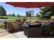 Beautiful patio with elegant furniture and a fire pit, perfect for relaxing or entertaining guests at 24733 E Park Crescent Dr, Aurora, CO 80016
