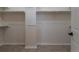 Empty walk-in closet featuring tiled floors, rods and shelving for storage at 24733 E Park Crescent Dr, Aurora, CO 80016