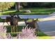 Local wildlife visiting the property, including deer amidst lush landscaping and blooming flowers at 24733 E Park Crescent Dr, Aurora, CO 80016