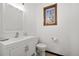 Bright bathroom with white vanity and toilet at 12105 Vaseen Ct, Conifer, CO 80433