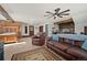 Primary bedroom with rustic wooden accents and a cozy sitting area at 12105 Vaseen Ct, Conifer, CO 80433