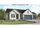 Charming single-Gathering home featuring board and batten siding, gray accents, and a well-manicured front lawn at 428 Clear Bell Ln, Monument, CO 80132