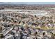 Wide aerial view of neighborhood with houses and streets at 10976 W 55Th Ln, Arvada, CO 80002