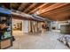 Unfinished basement with storage shelving and HVAC system at 10976 W 55Th Ln, Arvada, CO 80002