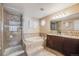 Bathroom features double vanity and soaking tub at 10976 W 55Th Ln, Arvada, CO 80002