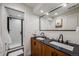 Basement bathroom with double vanity and walk-in shower at 10976 W 55Th Ln, Arvada, CO 80002