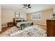 Spacious bedroom with ceiling fan and large window at 10976 W 55Th Ln, Arvada, CO 80002