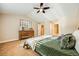 Main bedroom with ensuite bathroom access at 10976 W 55Th Ln, Arvada, CO 80002