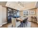 Elegant dining area with a farmhouse table and built-in hutch at 10976 W 55Th Ln, Arvada, CO 80002