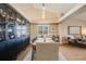 Bright dining room features a large wooden table and built-in black shelving at 10976 W 55Th Ln, Arvada, CO 80002