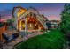 Spacious backyard with a patio area, and lush green lawn, perfect for relaxation and outdoor activities at 10221 Nucla St, Commerce City, CO 80022
